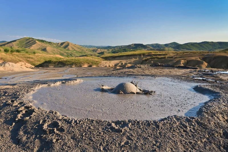 Bucharest: Muddy Volcanoes and Salt Mine Private Day Tour - Unirea Salt Mine in Slănic: huge caverns at a constant 12°C
