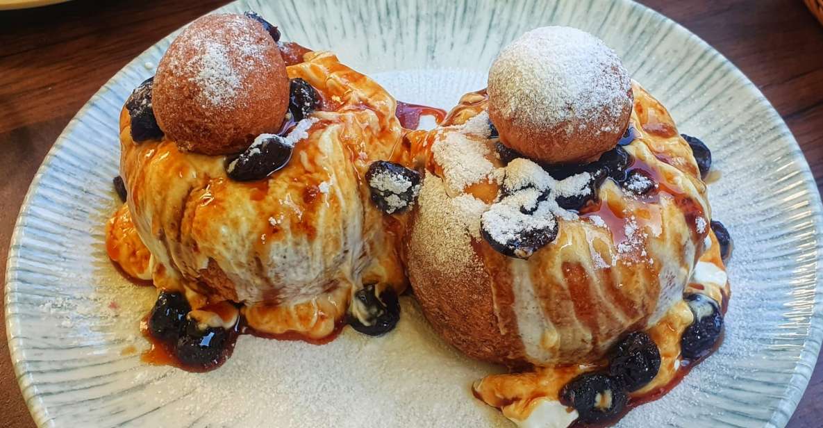 Bucharest: Sweet Delights History and Desserts Walking Tour - Old Town legends, then papanasi closes the chapter